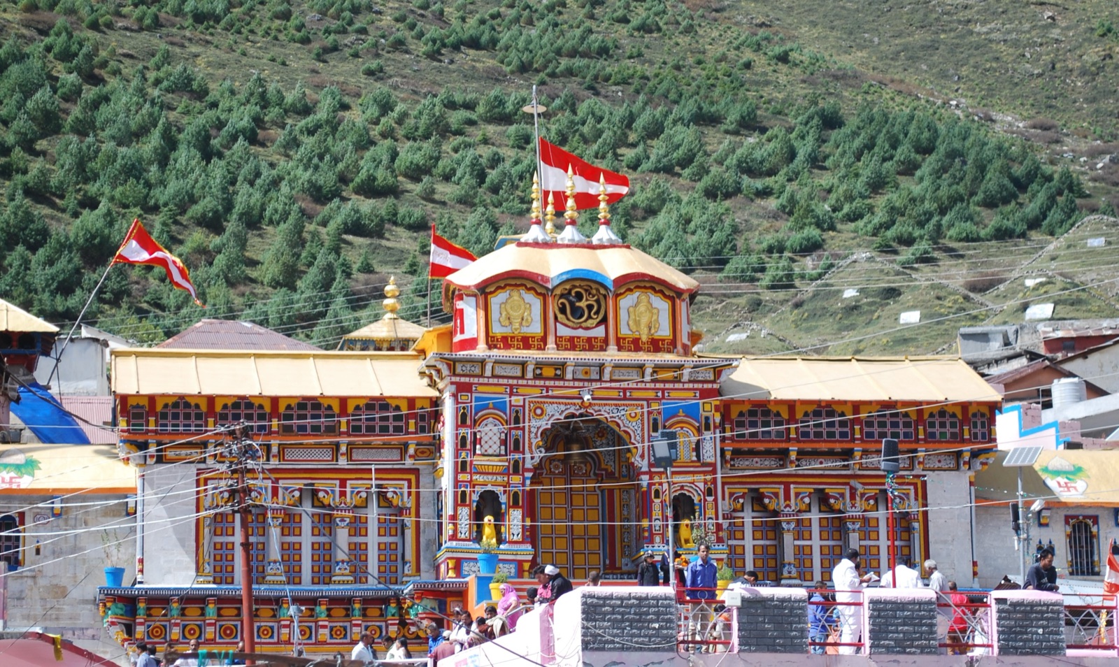 The colourful facade of Badrinath temple against the Himalayan peaks